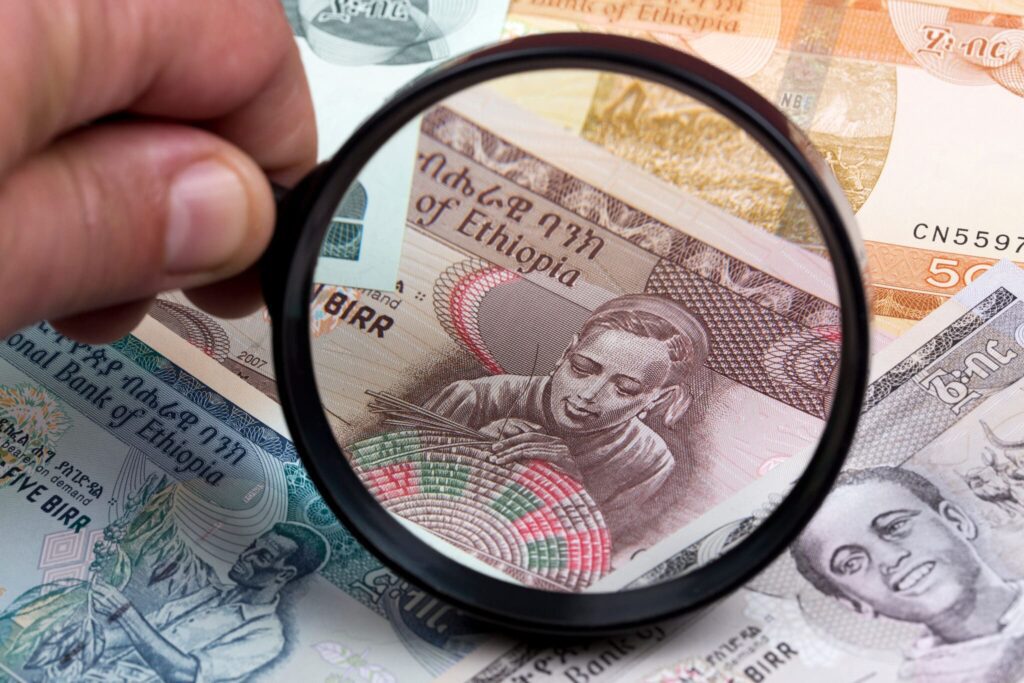 Ethiopia–U.S. Collaboration Targets Illicit Money Transfers Ethiopian,Birr,In,A,Magnifying,Glass,A,Business,Background
